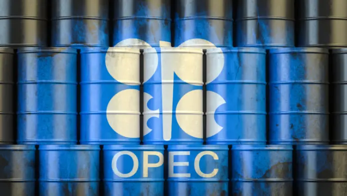 Oil barrels and production facilities as OPEC+ holds production steady
