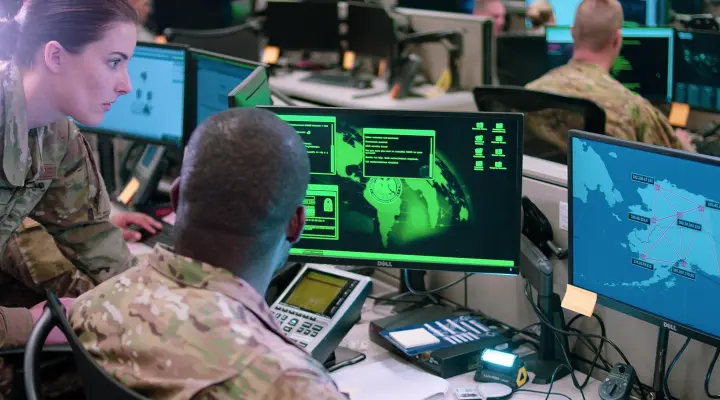 Cybersecurity experts monitoring network defense systems in the U.S.