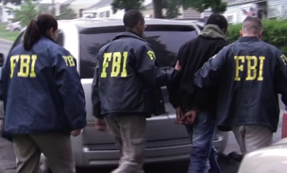 FBI agents investigating a multi-state financial fraud operation