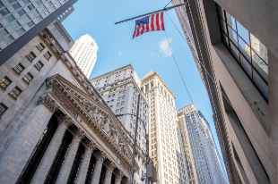 Wall Street trading floor showing tech stock gains and record highs