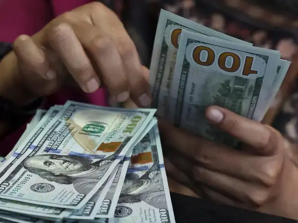 U.S. dollar stabilizes after policy-driven volatility in global currency markets